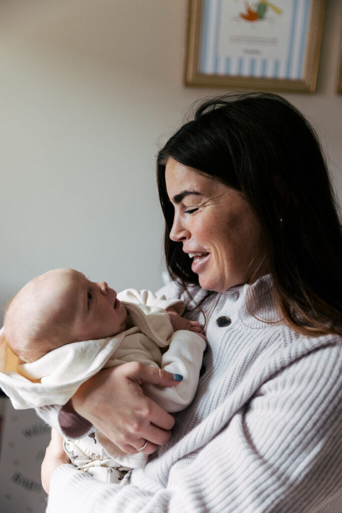 Mom and newborn share a smile