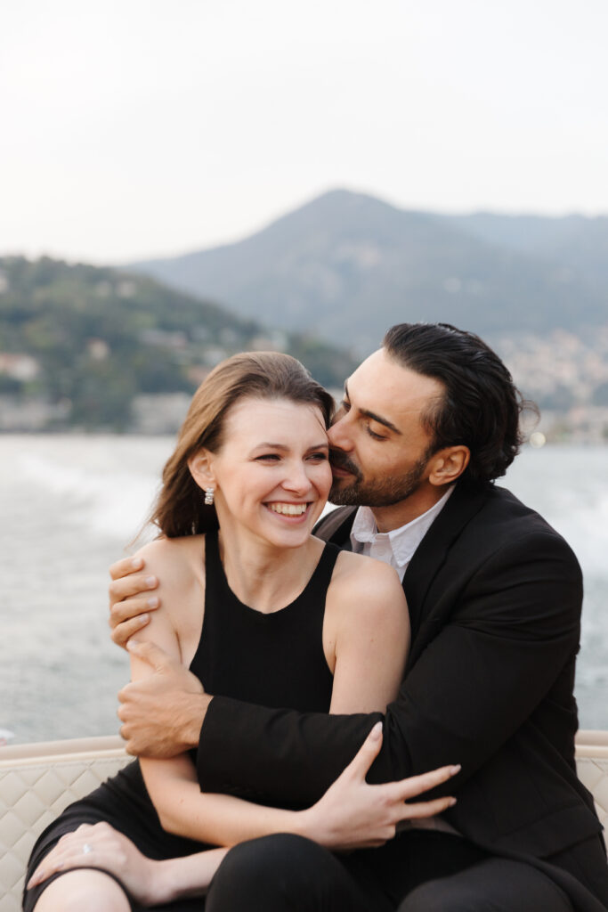 Couple on a boat in Lake Como, Italy.