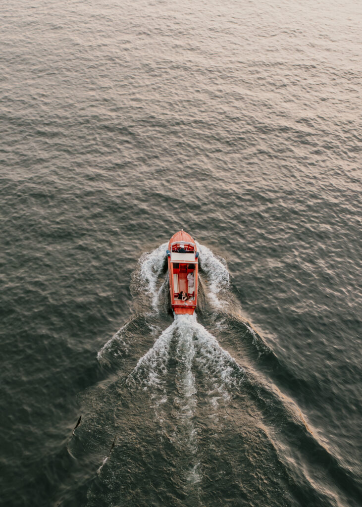 A boat on Lake Como, Italy from the view of the drone.